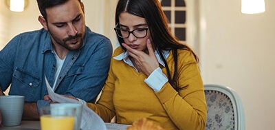 young family reviewing credit report together