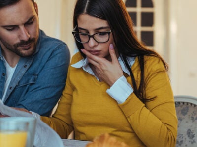 young family reviewing credit report together