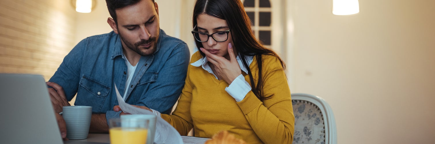 young family reviewing credit report together