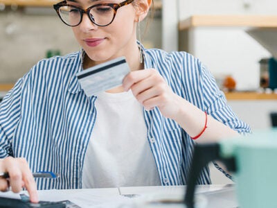 woman reviewing credit scores