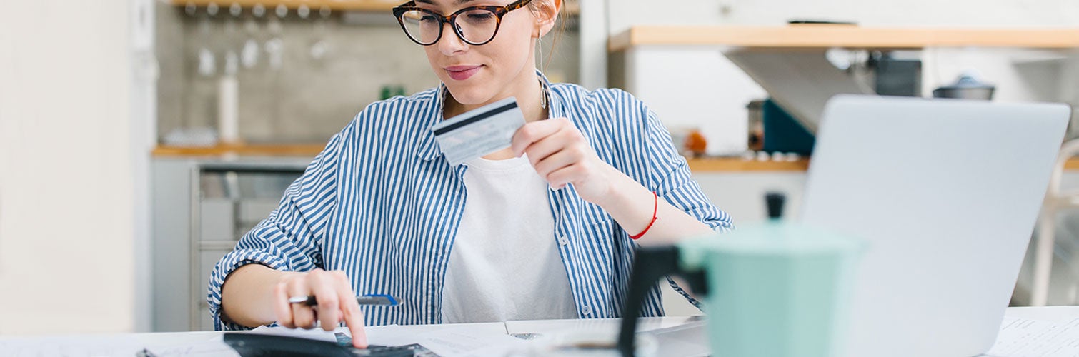 woman reviewing credit scores