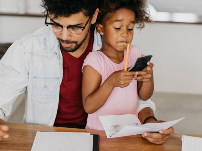 father reviewing financials with daughter