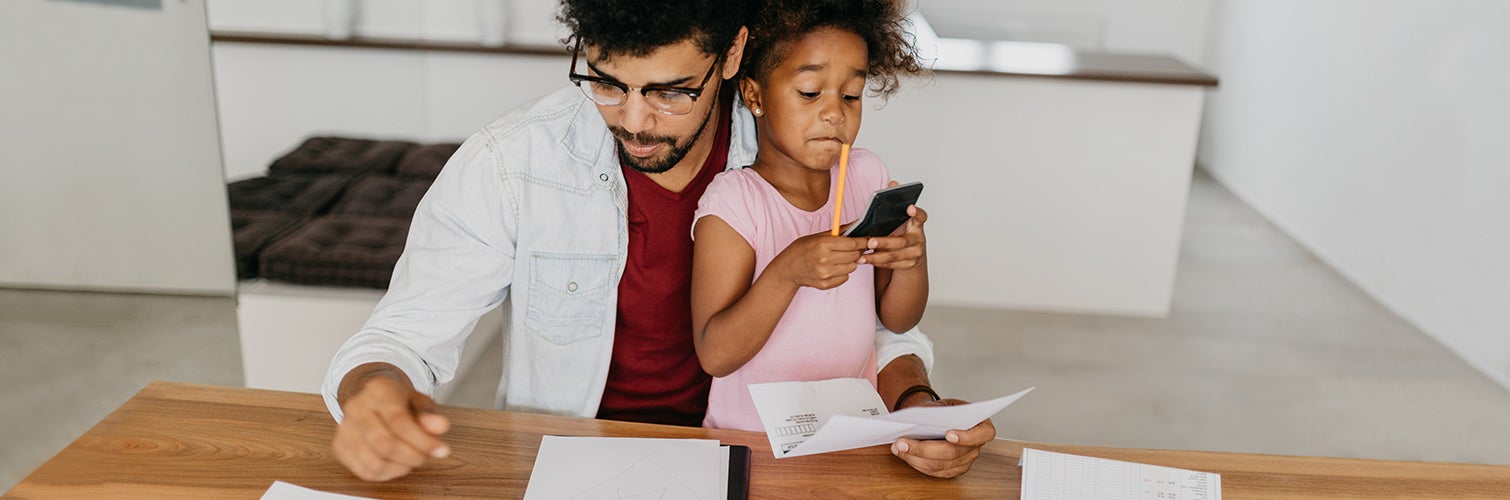 father reviewing financials with daughter