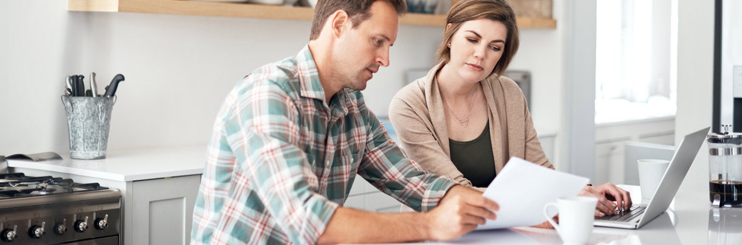 couple looking at finance papers