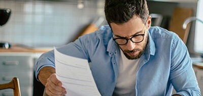 man checking debt