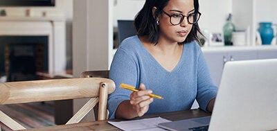 woman writing a pay for delete letter