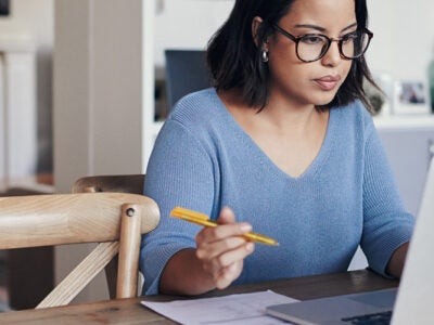 woman writing a pay for delete letter