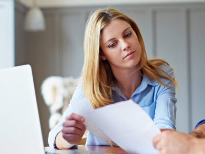 couple looking at paperwork in dining room