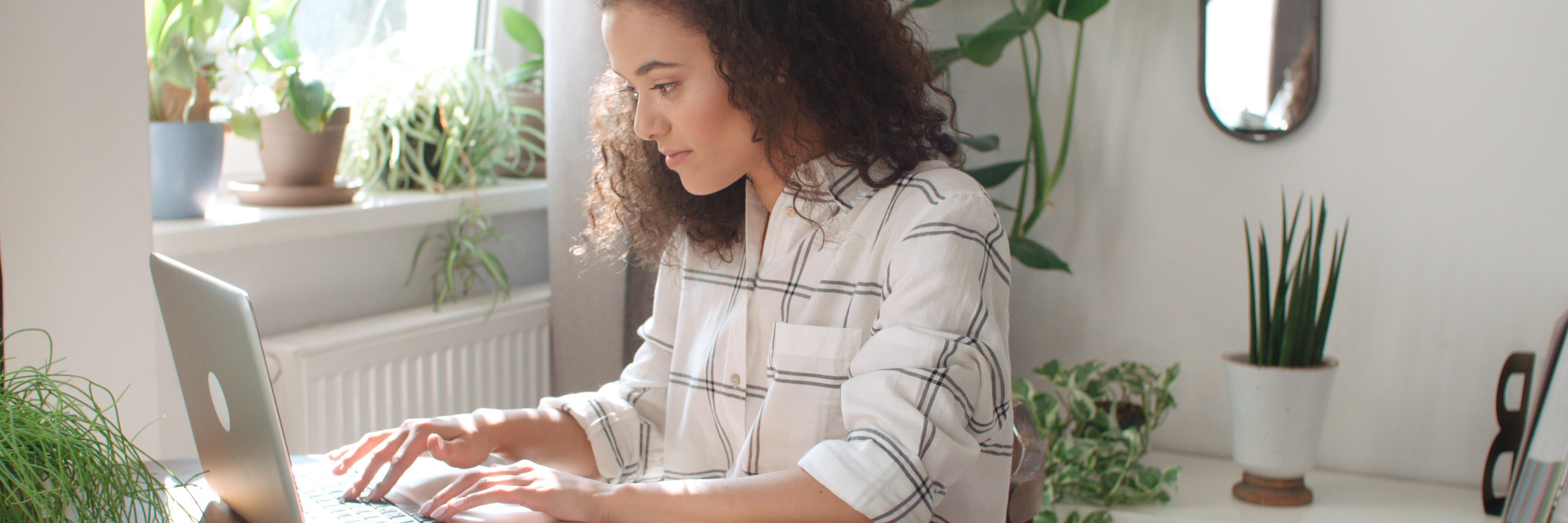 A woman looks at her computer.