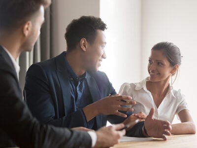 A group of people in a seated discussion.