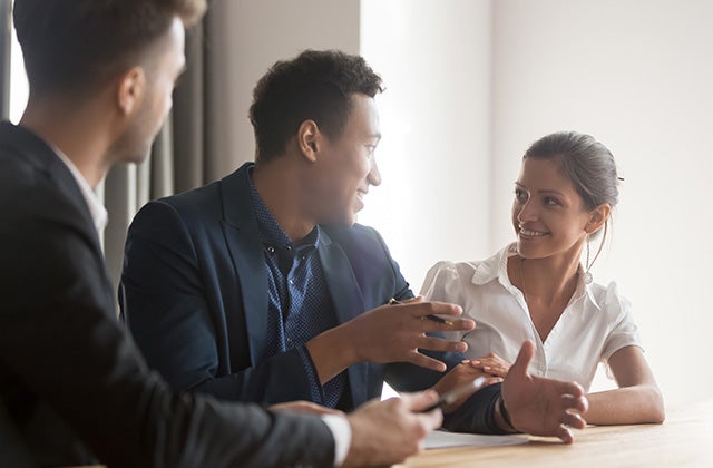 A group of people in a seated discussion.