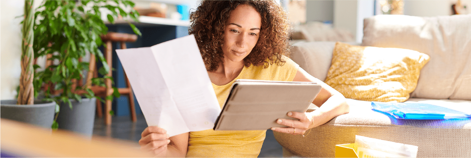 women checking financial documents