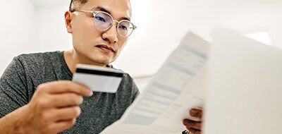 Man looking at credit report.