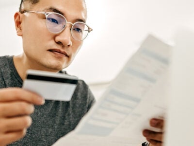 Man looking at credit report.