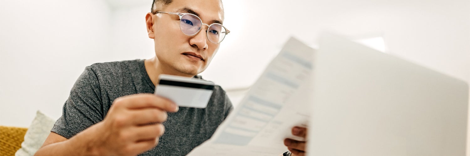 Man looking at credit report.