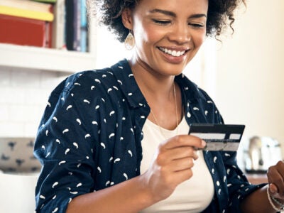 Woman paying off her credit card.