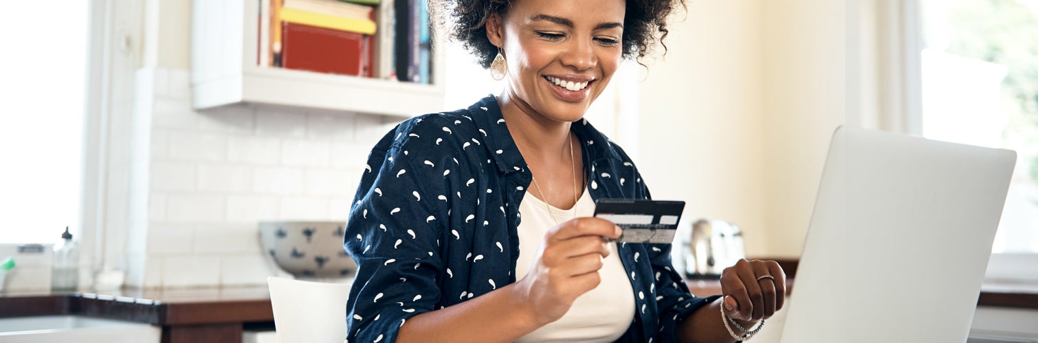 Woman paying off her credit card.