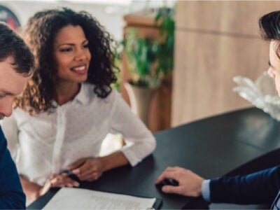 Couple discussing auto financing.