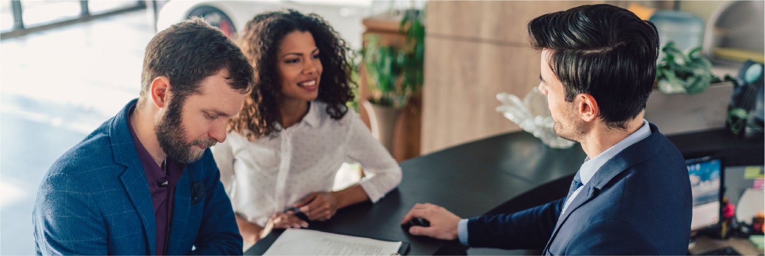 Couple discussing auto financing.