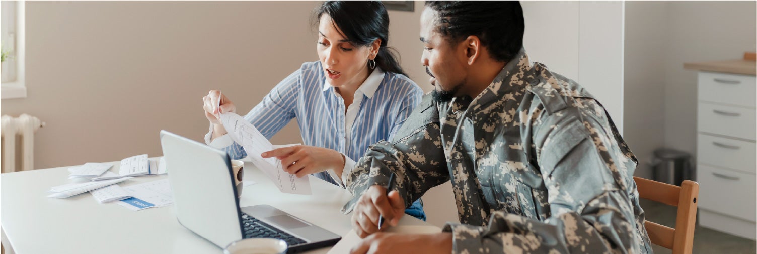 Veteran and his partner reviewing finances.