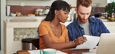 Couple reviewing finances.