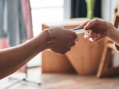 Woman using prepaid card while shopping.