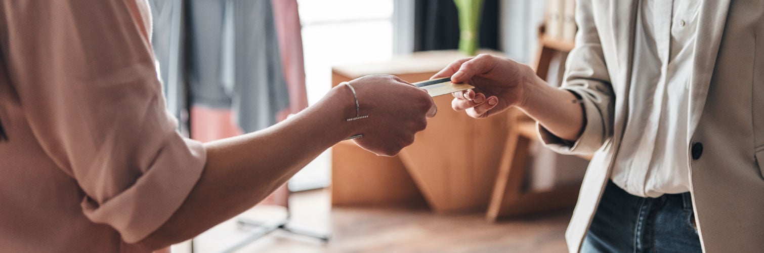 Woman using prepaid card while shopping.