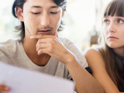 Couple looking over paperwork together.