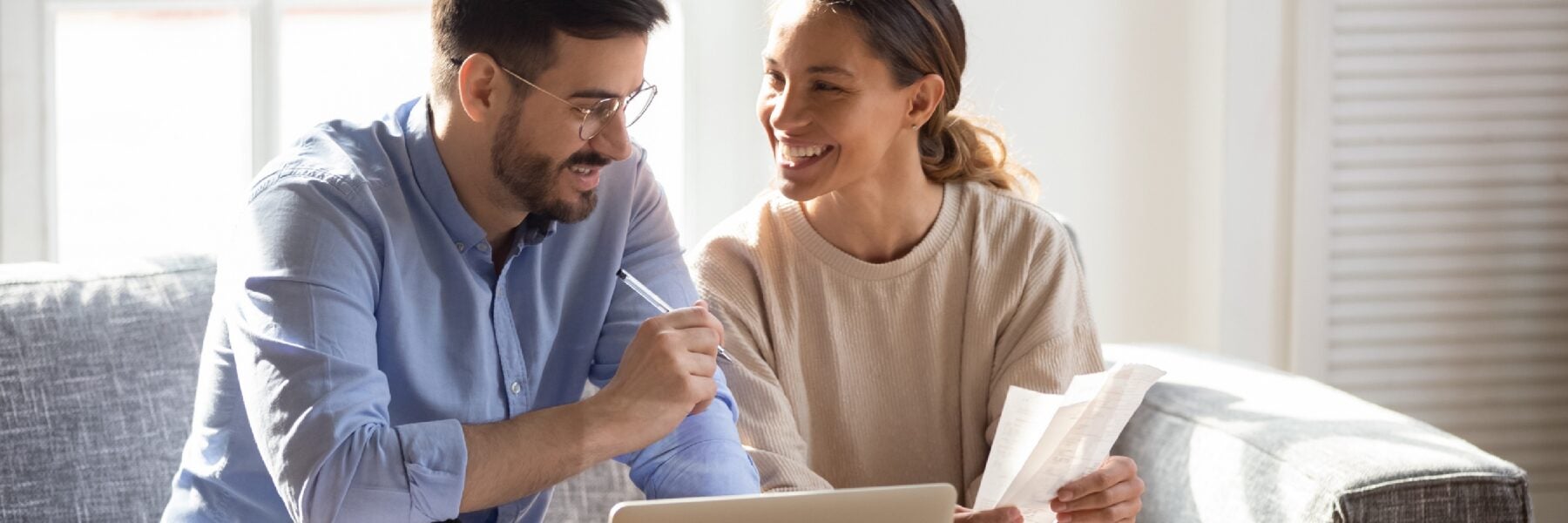 Couple looking at finances together.