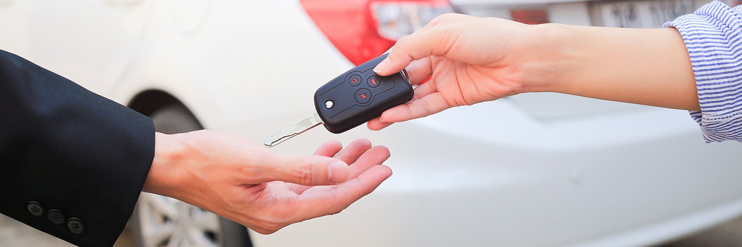 Handing over car keys.