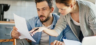 Couple looking at finances together.
