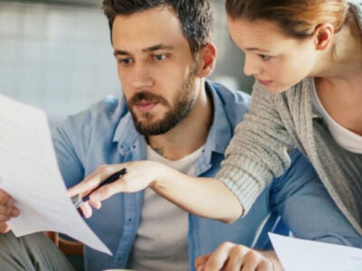 Couple looking at finances together.