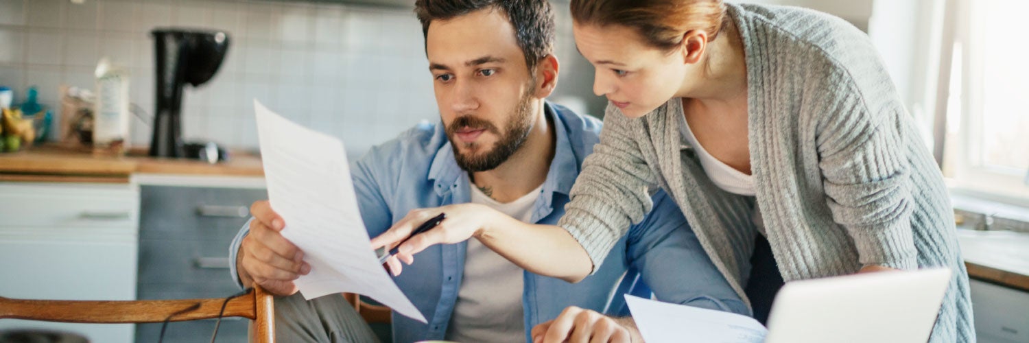 Couple looking at finances together.