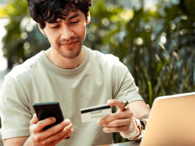 Man looking at credit card