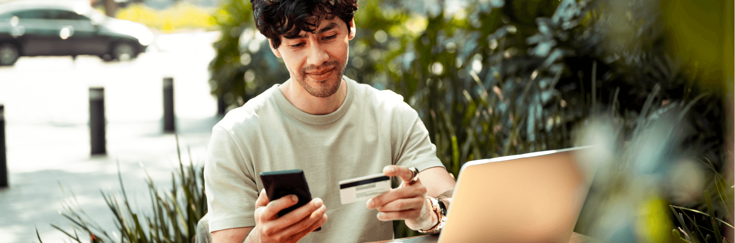 Man looking at credit card