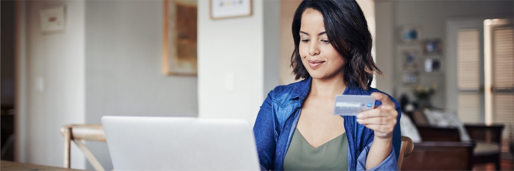 Woman looking at laptop.