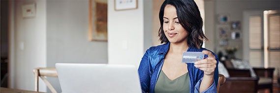 Woman looking at laptop.