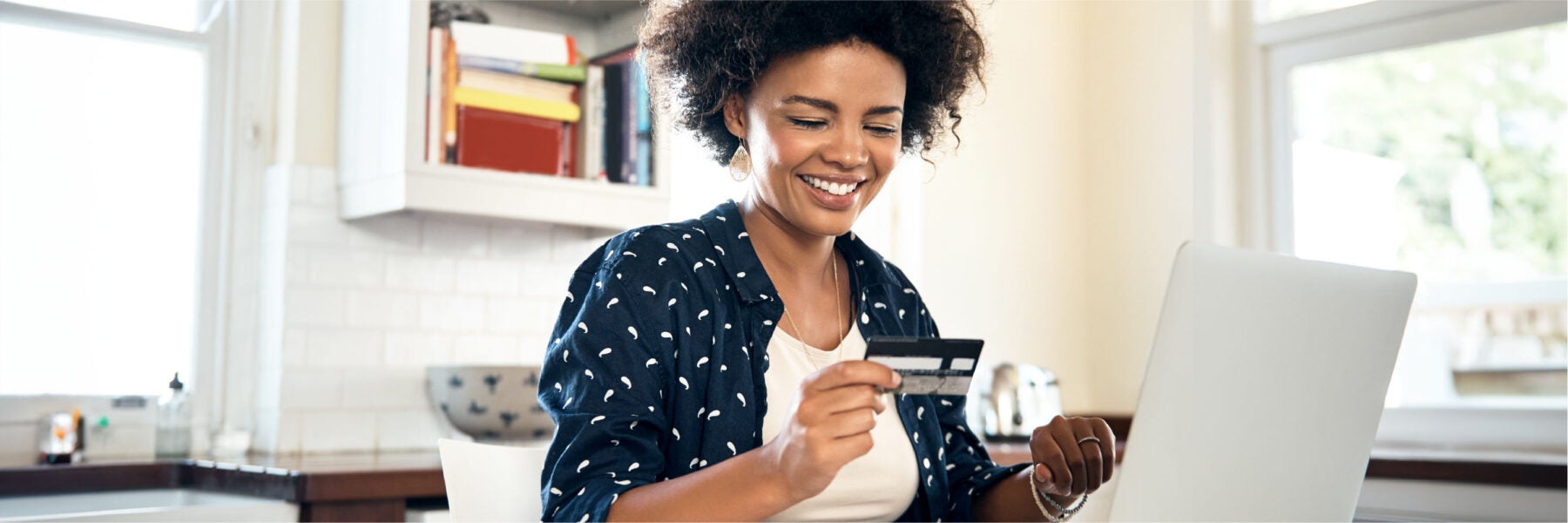 A person learning how to build credit with a secured credit card.