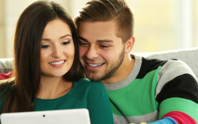 couple looking at computer rebuilding credit