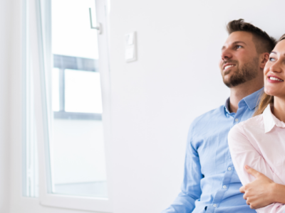 Couple sitting indoors, representing confidence after building a positive credit history