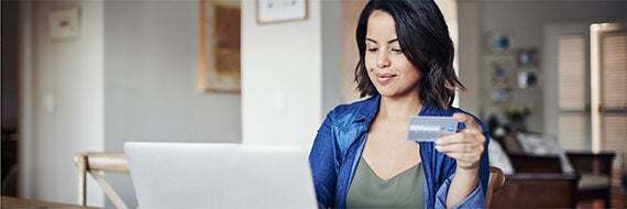 Woman looking at laptop.